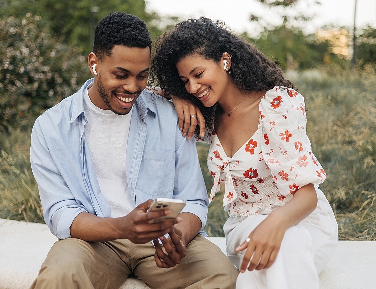 Couple enjoying time together, looking at phone.